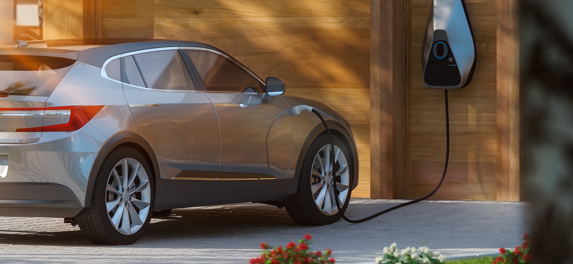 A sleek electric vehicles plugged into a home charging station