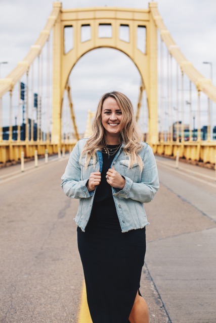 Headshot of woman standing on bridge in Pittsburgh, PA